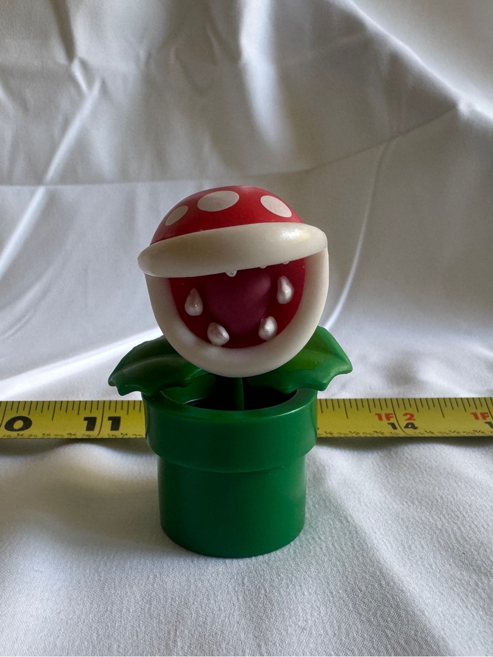 Plastic toy figure of Piranha Plant from Nintendo's Super Mario Bros. franchise